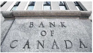  ?? REUTERS/CHRIS WATTIE/FILE ?? A sign is pictured outside the Bank of Canada building in Ottawa on May 23, 2017.