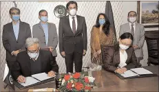  ?? -APP ?? Federal Minister Khusro Bakhtyar witnessing the signing of policy-based loan agreement between the Govt of Pakistan and the ADB signed by Secretary Economic Affairs Division Noor Ahmed and Country Director ADB Xiaohang Yang.