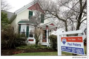  ?? AP/STEVEN SENNE ?? A home in Natick, Mass., waits for a buyer. Americans purchased homes in March at the fastest pace in more than a decade.