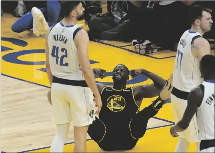  ?? AP PHOTO/JEFF CHIU ?? Golden State Warriors forward Draymond Green (23) reacts after scoring and being fouled behind Dallas Mavericks forward Maxi Kleber (42) and guard Luka Doncic, right, during the first half of Game 1 of the NBA basketball playoffs Western Conference finals in San Francisco, ON Wednesday.