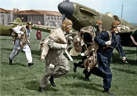  ??  ?? Reach for the sky: Spitfire pilots rush for the planes as the klaxon sounds at Duxford Aerodrome in 1939