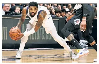  ?? Getty Images ?? MAV NOT: Kyrie Irving looks to drive during the Mavericks’ 110-104 win over the Clippers in his first game in Dallas after the Nets traded him Sunday.