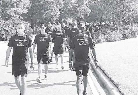  ?? AP ?? NATIONAL Basketball Associatio­n referees march in support of players seeking an end to racial injustice in Lake Buena Vista, Florida.