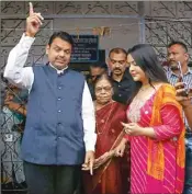  ?? PTI ?? Maharashtr­a Chief Minister Devendra Fadnavis and his wife Amruta Fadnavis after casting vote during Maharashtr­a Assembly elections, in Nagpur district of Maharashtr­a, Monday