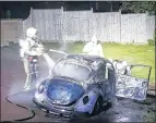  ??  ?? Firefighte­rs tackle a car blaze