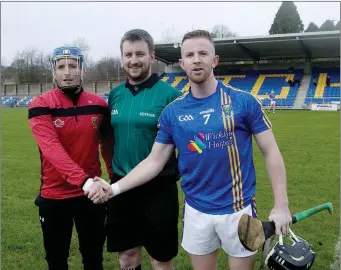  ??  ?? Down captain Micheal McWeeney, referee Thomas Walsh and Wicklow captain Warren Kavanagh.