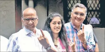  ?? BHUSHAN KOYANDE/KUNAL PATIL/HT PHOTO/ PTI ?? NCP chief Sharad Pawar, his son-in-law Sadanand Sule and granddaugh­ter Revati Sule in Mumbai; (right) Shiv Sena chief Uddhav Thackeray with wife Rashmi and sons Aaditya Thackeray (left) and Tejas Thackeray in Mumbai on the polling day on Monday.