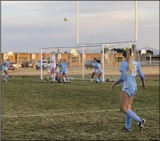  ?? ALAN HENDRY/Valley Press ?? PERFECT THROW — Quartz Hill junior Michelle Hess watches as her throw-in travels to the goal in a CIF-Southern Section Division 3 First Round game against Windward on Thursday. The Rebels scored three goals on Hess’ throw-ins in a 7-0 victory.