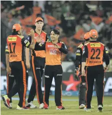  ?? AFP ?? Rashid Khan, centre, delivered 18 dot balls to equal an IPL record for a spinner in Hyderabad’s victory over Mumbai