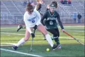  ?? THOMAS NASH - DIGITAL FIRST MEDIA ?? Lower Dauphins’s Kate Sparks (8) rears back to send one upfield while Methacton’s Frankie Lucchesi (6) tries to get her stick in during Saturday’s game.