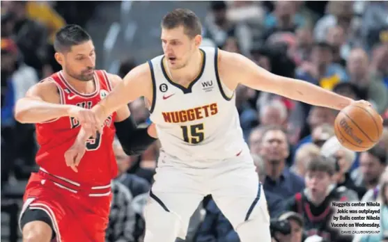  ?? DAVID ZALUBOWSKI/AP ?? Nuggets center Nikola Jokic was outplayed by Bulls center Nikola Vucevic on Wednesday.