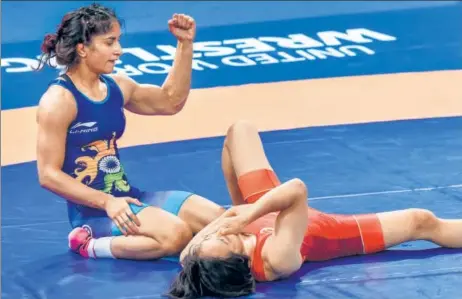  ?? PTI ?? ▪ Vinesh Phogat reacts after defeating Japan’s Yuki Irie in women's freestyle 50 kg final at the Asian Games 2018 in Jakarta on Monday.