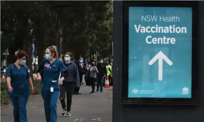  ?? Photograph: Lisa Maree Williams/Getty Images ?? The Covid vaccinatio­n hub in Homebush, Sydney. A study found a $300 cash incentive would see about 40% of vaccine hesitant Australian­s change their mind and get vaccinated.