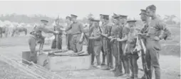  ?? LIBRARY AND ARCHIVES CANADA ?? Canadian soldiers at Kingston, Ont., returning their Ross Rifles. The 1st Division used Ross Rifles in the trenches at Ypres, eventually switching to Lee-Enfields.