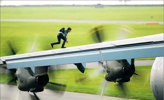  ?? Christian Black Paramount Pictures / Skydance Production­s ?? ACTOR TOM CRUISE begins a scene on a military plane that takes off and lands as he clings to the outside of the aircraft in “Mission: Impossible — Rogue Nation.”