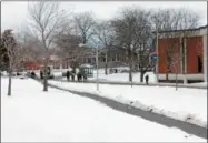  ??  ?? Police escort students to safety during a lock down at Utica College on Monday, March 5, 2018.