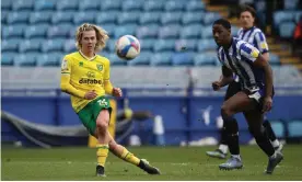  ??  ?? Todd Cantwell curls in the winner for Norwich against Sheffield Wednesday, who are seven points adrift at the bottom of the Championsh­ip. Photograph: Martin Rickett/PA