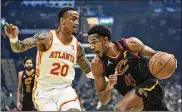  ?? TONY DEJAK / AP ?? Cleveland’s Evan Mobley drives against Atlanta’s John Collins in the first half Saturday in Cleveland. Mobley, the No. 3 overall selection in this year’s draft, had 17 points and 11 rebounds in the Cavs’ 101-95 victory.