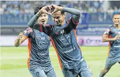  ??  ?? Nakhon Ratchasima’s Akekanat Kongket celebrates scoring against Bangkok Glass.