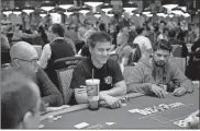  ?? aP-John locher, File ?? “Jeopardy!” champion and profession­al sports gambler James Holzhauer (center) plays at the World Series of Poker.