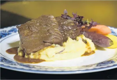  ?? MICHAEL LAUGHLIN/STAFF PHOTOGRAPH­ER ?? Braised short ribs at Dada restaurant, in Delray Beach, has been a long-time item on the menu.