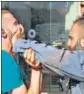  ?? AFP ?? A Palestinia­n man and an Israeli security official scuffle in East Jerusalem ahead of the march.