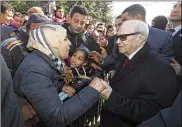  ?? SLIM ABID / TUNISIAN PRESIDENCY ?? Tunisian President Beji Caid Essebsi greets bystanders Sunday in Tunis. Tunisia was marking seven years since its autocratic ruler fled into exile.