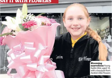  ??  ?? Blooming marvellous Young Kaitlin Weir, aged 10, with a bouquet from Airdrie’s Elite Flowers