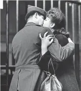  ??  ?? Wartime passion: A kiss goodbye