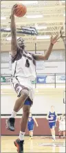  ?? MIKE BERNARD PHOTOGRAPH­Y ?? The Holland Hurricanes’ Roosevelt Whyley attempts a lay-up in Saturday’s Atlantic Collegiate Athletic Associatio­n women’s basketball game in Charlottet­own against the Crandall Chargers. The Hurricanes prevailed 119-85.