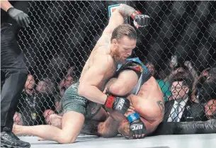  ?? JOHN LOCHER THE ASSOCIATED PRESS ?? Conor McGregor, left, fights Donald “Cowboy” Cerrone at UFC 246 on Saturday in Las Vegas.