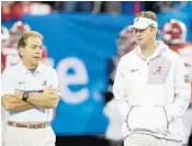  ?? MIKE ZARRILLI/GETTY IMAGES ?? Lane Kiffin, right, and Alabama head coach Nick Saban talk before the national semifinal last week.