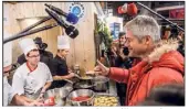  ?? (Photo EPA) ?? Toujours vêtu de rouge lorsqu’il est sur le terrain, Laurent Wauquiez à fait, hier, la tournée des stands au Salon de l’agricultur­e.