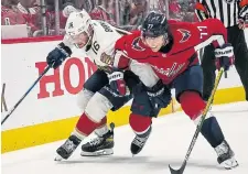  ?? ALEX BRANDON THE ASSOCIATED PRESS ?? Aleksander Barkov, left, helped the Panthers shrug off T.J. Oshie and the Capitals, Florida’s first playoff series win since 1996.