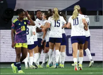  ?? PHOTO BY RAUL ROMERO JR. ?? U.S. forward Jaedyn Shaw, fourth from left, smiles and celebrates after scoring against Colombia on Sunday.