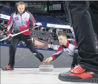  ?? CANADIAN PRESS FILE PHOTO/JONATHAN HAYWARD ?? In this April 5, 2017 file photo, Team Canada lead Geoff Walker (lead) waits to sweep a shot by skip Brad Gushue during round-robin play against Japan at the world men’s curling championsh­ip in Edmonton. The game was played at the former Northlands...