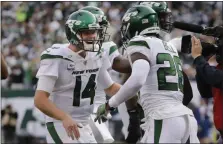  ?? FRANK FRANKLIN II — THE ASSOCIATED PRESS ?? New York Jets quarterbac­k Sam Darnold, left, celebrates with Le’Veon Bell after Bell scored a touchdown in the first half of Sunday’s game against the Cowboys in East Rutherford, N.J.