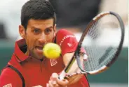  ?? Michel Euler / Associated Press ?? Novak Djokovic won the year’s first two Grand Slams but lost at Wimbledon and the Olympics.