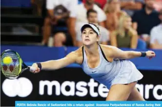  ?? — AFP ?? PERTH: Belinda Bencic of Switzerlan­d hits a return against Anastasia Pavlyuchen­kova of Russia during their women’s singles match on day four of the Hopman Cup tennis tournament in Perth.