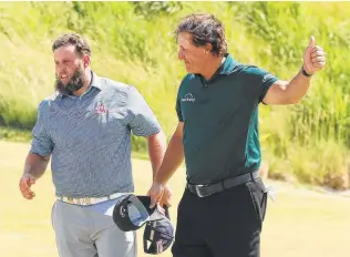  ?? Andrew Redington / Getty Images ?? When thinking of the 2018 U.S. Open, many will think of how tough Shinnecock Hills played and how Phil Mickelson, with playing partner Andrew “Beef” Johnston, hit a rolling ball on the green.