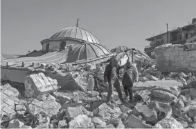  ?? YASIN AKGUL/AFP VIA GETTY IMAGES ?? Searchers were still pulling survivors from the rubble of Monday’s earthquake that killed more than 23,000 people in Turkey and Syria, even as the window for rescues narrowed.