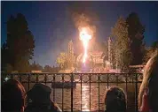  ?? SHAWNA BELL — HANDOUT ONE TIME USE, SHAWNA BELL ?? This photo courtesy of Shawna Bell shows a fire during the “Fantasmic” show in the Tom Sawyer Island section of Disneyland resort in Anaheim on Saturday.
