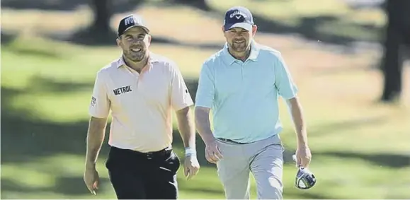  ?? ?? ↑ Richie Ramsay, left, and David Drysdale, pictured playing together in the Spanish Open last month, both held on to their cards for another season