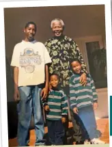  ??  ?? Ndaba and his brothers Andile (middle) and Mbuso with Madiba.