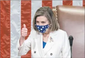  ?? J. Scott Applewhite The Associated Press ?? Speaker of the House Nancy Pelosi leads the vote to approve President Joe Biden’s $1.9 trillion coronaviru­s relief package Wednesday at the Capitol in Washington.