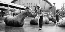  ??  ?? Clean-up crews were hard at work Monday getting the Calgary Stampede grounds ready.