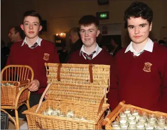  ??  ?? St. Peter’s students Daniel McCarthy, John Banville and Cian O’Feinneadha with their mini company enterprise, Coinnle Cairdiúil.