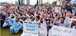  ?? Agence France-presse ?? Traders from the North Waziristan tribal district shout slogans during a protest in Islamabad on Saturday. Traders from N.waziristan are protesting following military operations in 2014 against the Taliban, that they say damaged local business.