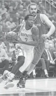  ?? Karen Warren / Houston Chronicle ?? Pat Beverley takes a first-half drive past Oklahoma City center Steven Adams during the concluding game of their series Tuesday night at Toyota Center.