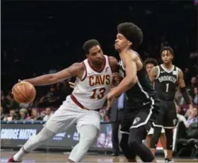  ?? HOWARD SIMMONS - ASSOCIATED PRESS ?? Tristan Thompson drives on Nets guard Allen Crabbe during the first half Dec. 3 in New York.